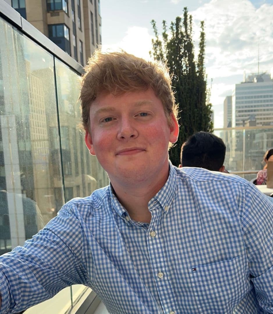 Picture of Will at a rooftop restaurant.